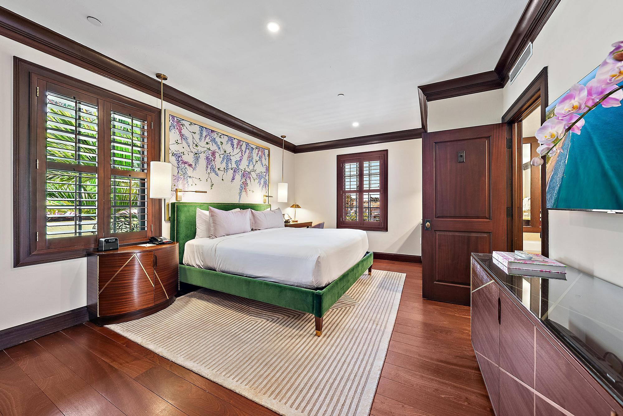 301 Australian Avenue, Unit 305 Palm Beach, FL 33480 - Photo 5 of 19 a bed room with a bed and a large window