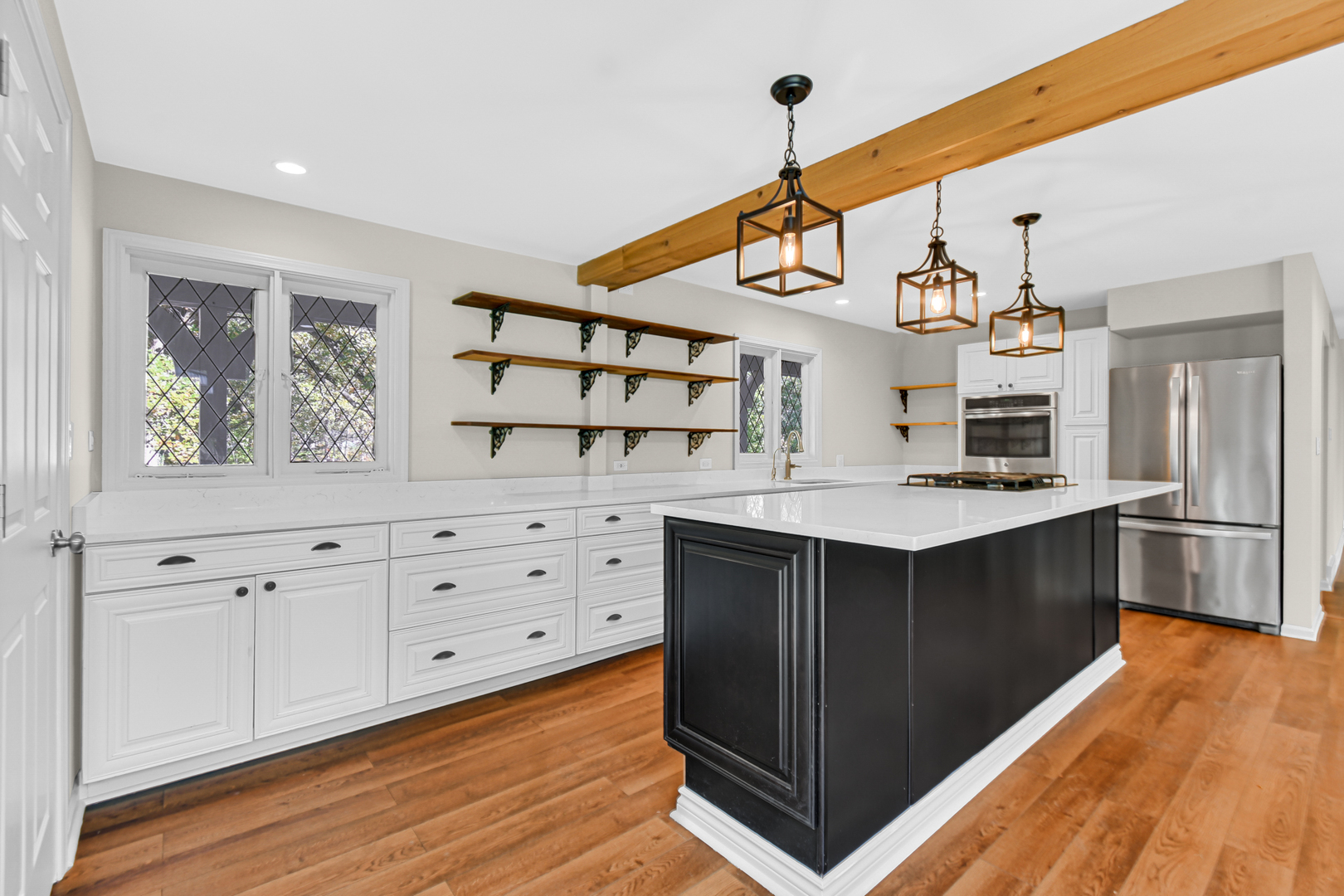 106 Cornwall Drive Crete, IL 60417 - Photo 11 of 29 a kitchen with stainless steel appliances granite countertop a stove and cabinets