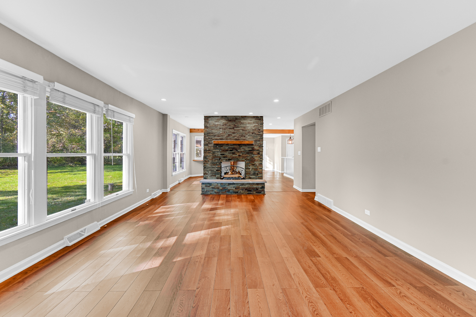 106 Cornwall Drive Crete, IL 60417 - Photo 6 of 29 a view of empty room with wooden floor and fireplace
