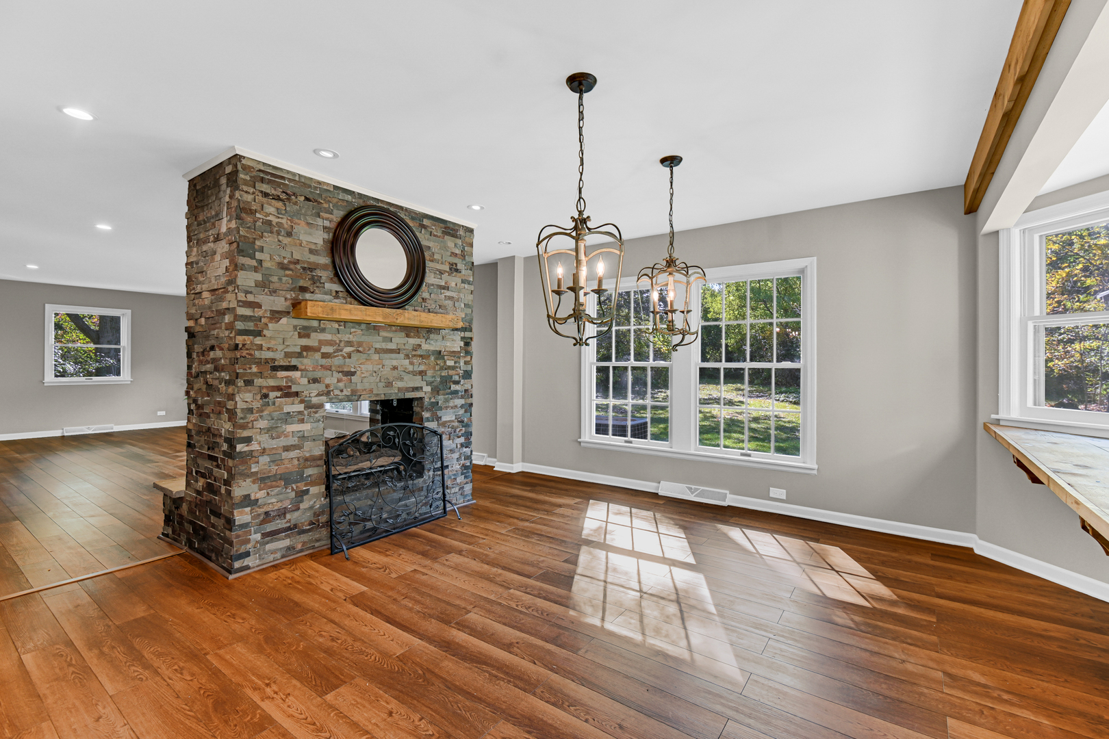 106 Cornwall Drive Crete, IL 60417 - Photo 7 of 29 a view of an empty room with a window and wooden floor