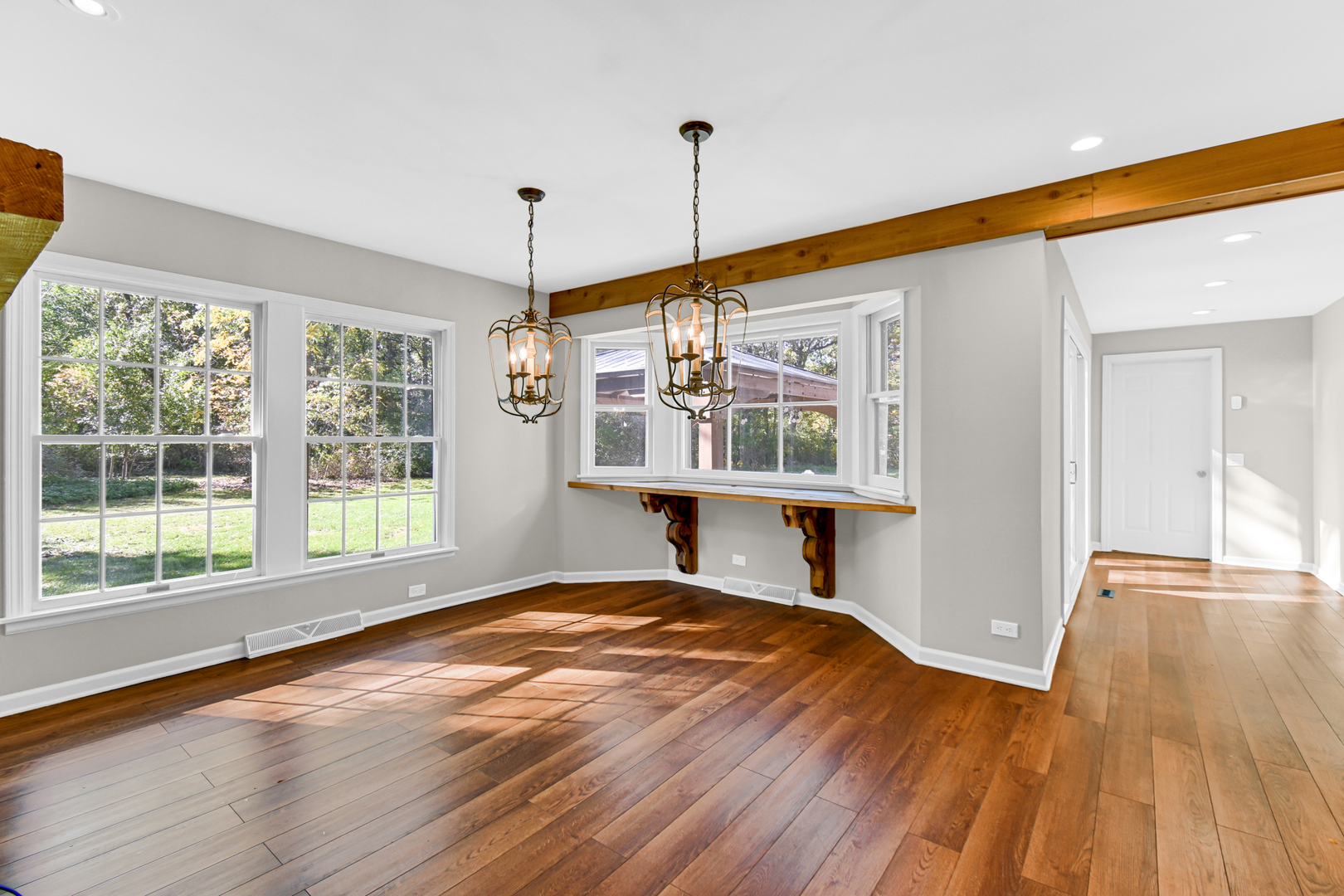 106 Cornwall Drive Crete, IL 60417 - Photo 8 of 29 a view of an empty room with wooden floor and a window