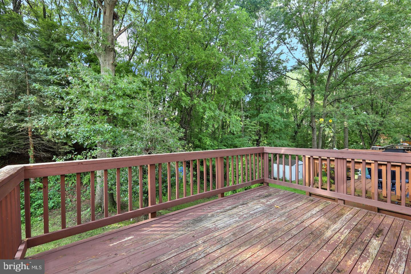 2629 Ebony Road Baltimore, MD 21234 - Photo 30 of 32 Serene deck overlooking lush greenery.