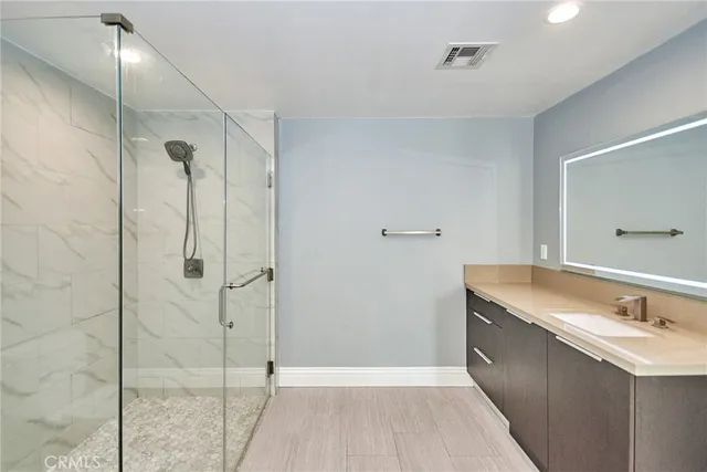 a bathroom with a shower and toilet