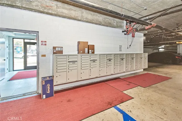 a view of a living room kitchen with furniture and fireplace