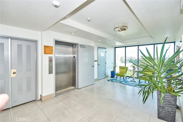 a kitchen with stainless steel appliances granite countertop a refrigerator and a stove