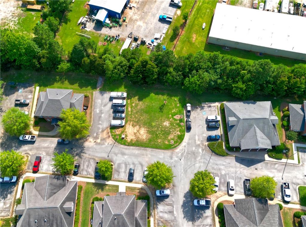 2151 Eatonton Road Madison, GA 30650 - Photo 4 of 16 an aerial view of residential houses with outdoor space and street view
