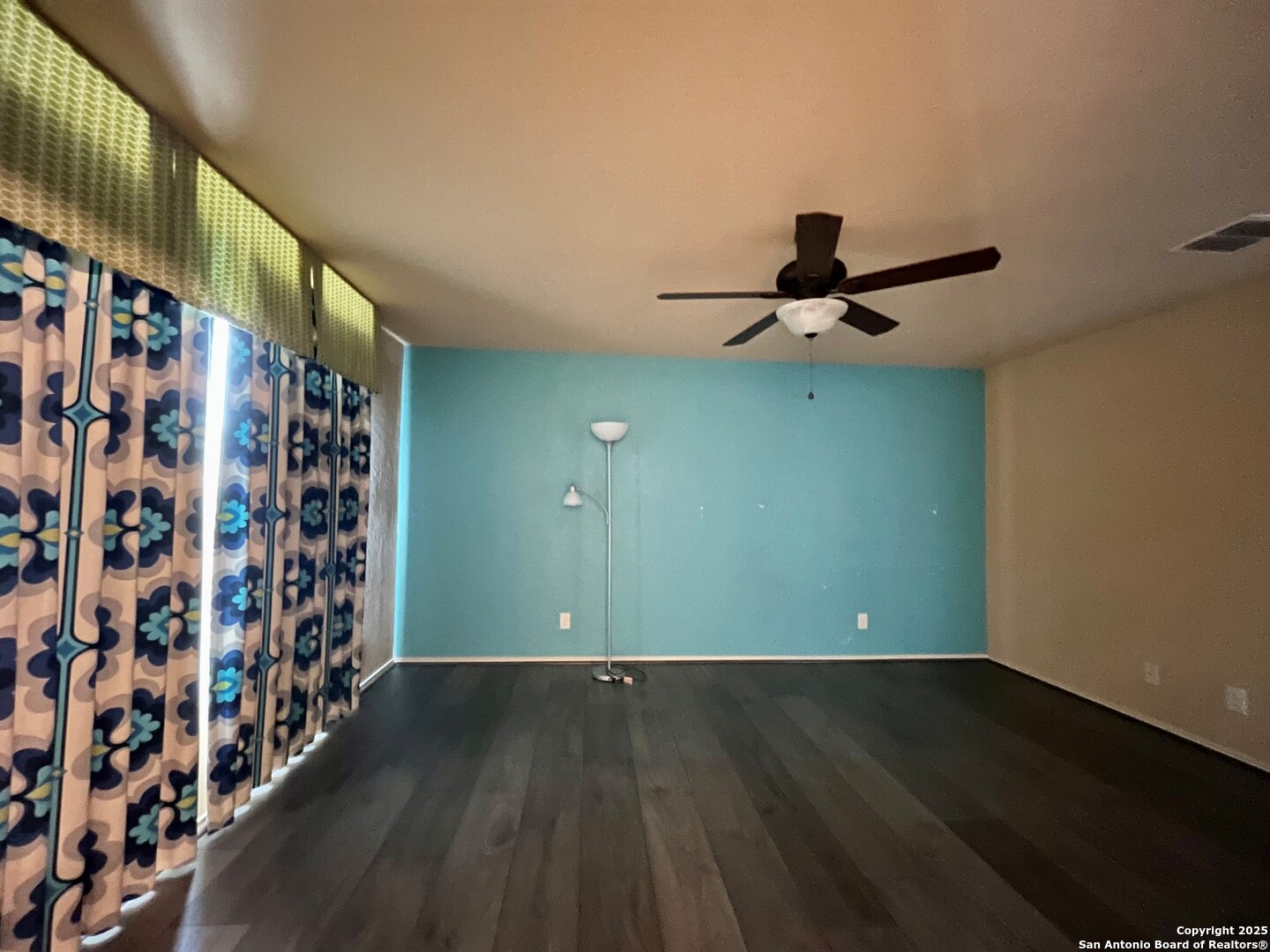 426 Tequila Ranch San Antonio, TX 78245 - Photo 16 of 24 a view of a room with wooden floor staircase and a ceiling fan
