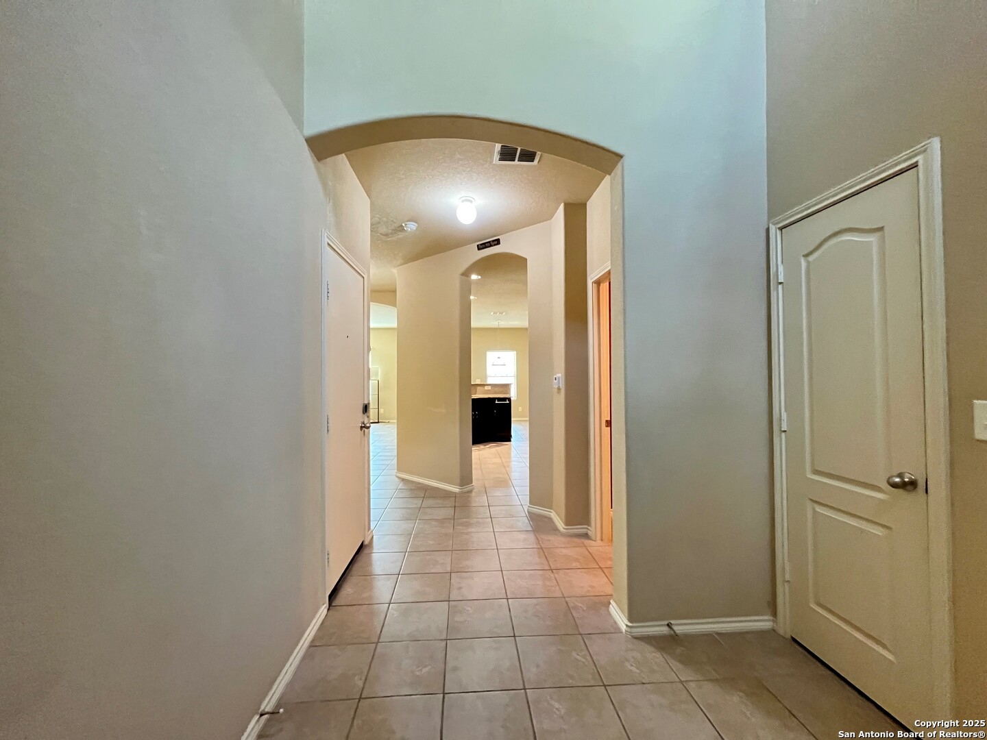 426 Tequila Ranch San Antonio, TX 78245 - Photo 3 of 24 a view of a hallway with wooden shelves