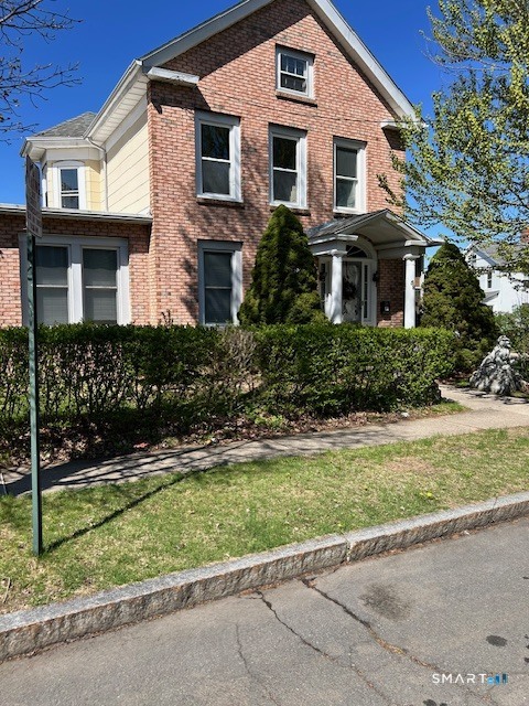 a front view of a house with a yard