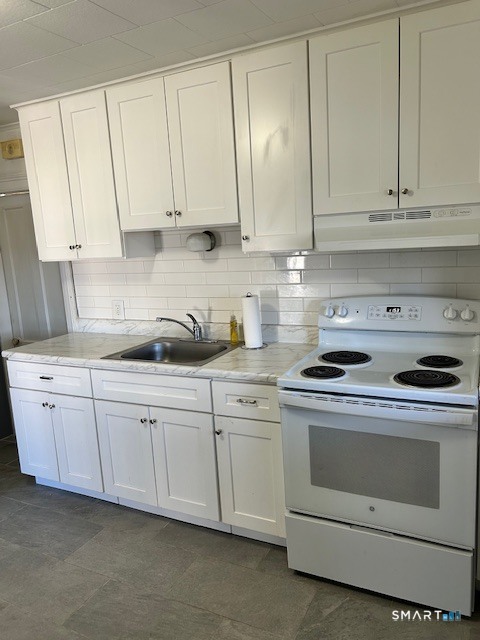 59 Park Place Middletown, CT 06457 - Photo 13 of 13 a kitchen with granite countertop white cabinets and white appliances