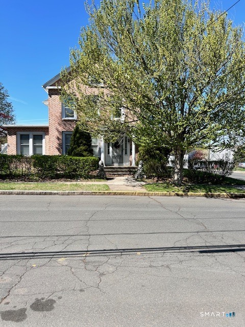 59 Park Place Middletown, CT 06457 - Photo 2 of 13 a view of house with a yard and potted plants