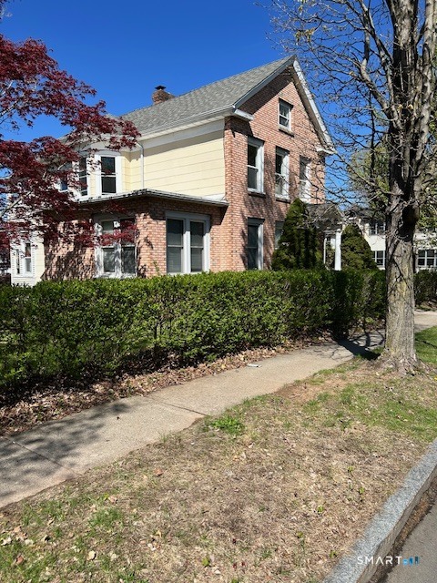 59 Park Place Middletown, CT 06457 - Photo 3 of 13 a front view of a house with a yard