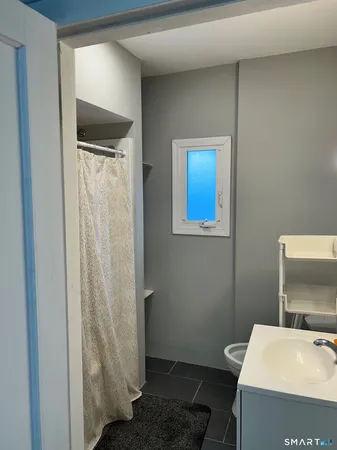 a bathroom with a sink toilet and vanity