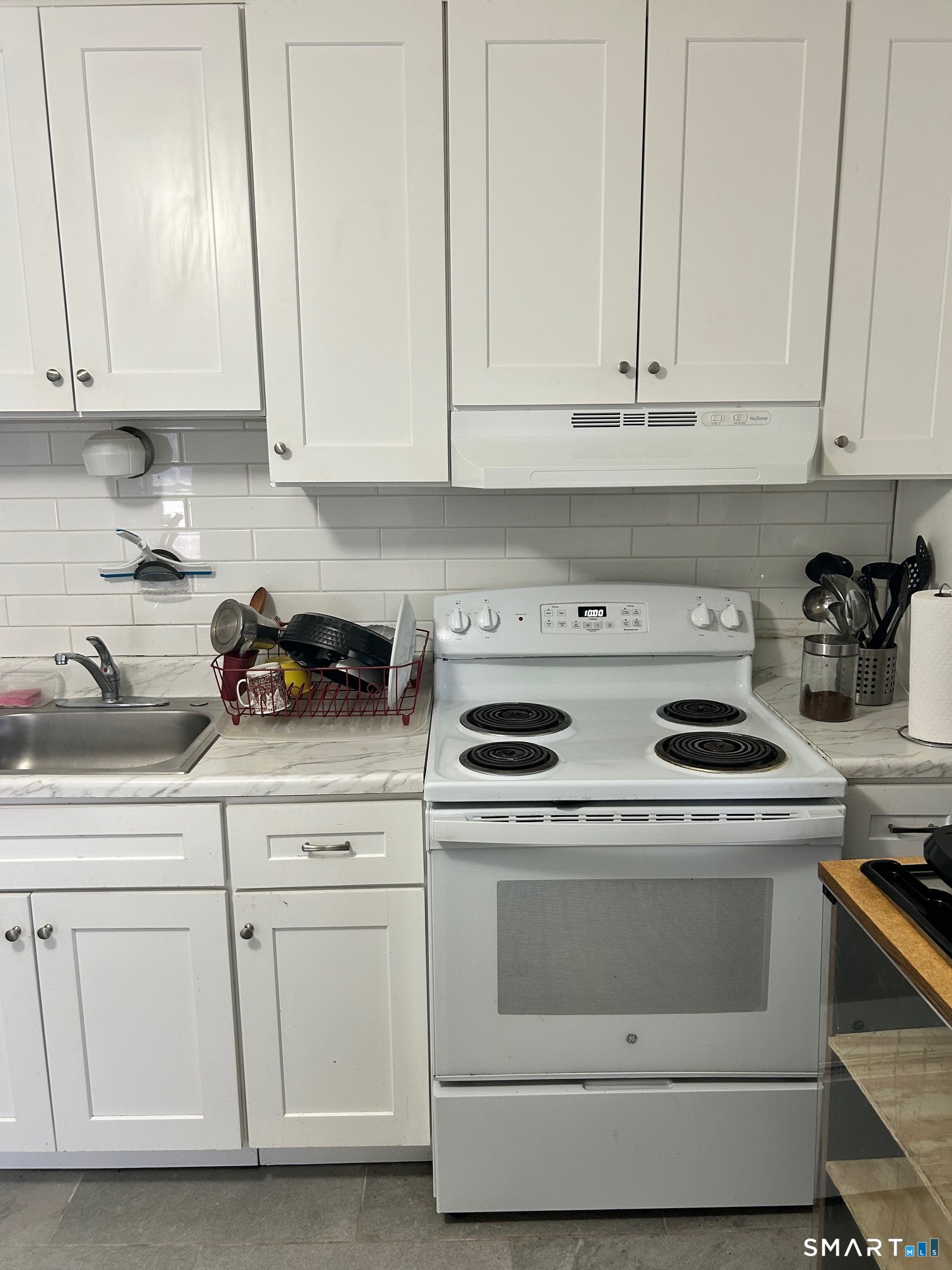 59 Park Place Middletown, CT 06457 - Photo 6 of 13 a kitchen with white cabinets and white appliances