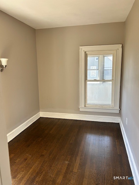 59 Park Place Middletown, CT 06457 - Photo 7 of 13 a view of an empty room with wooden floor and a window
