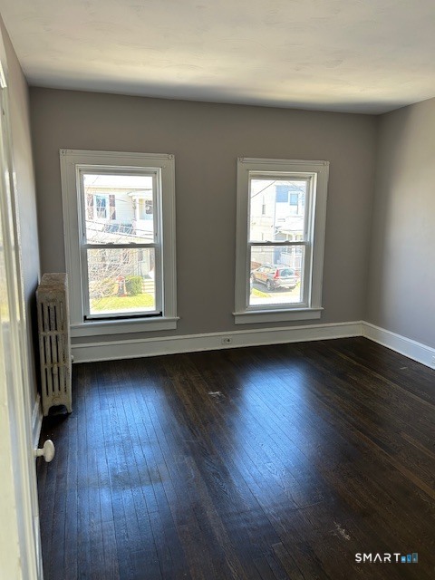 59 Park Place Middletown, CT 06457 - Photo 8 of 13 an empty room with wooden floor and windows