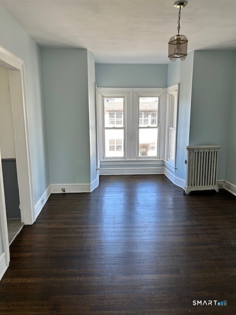 59 Park Place Middletown, CT 06457 - Photo 10 of 13 an empty room with wooden floor and windows