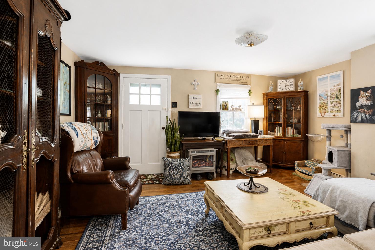 1470 River Road Titusville, NJ 08560 - Photo 21 of 50 a living room with furniture a flat screen tv and kitchen view