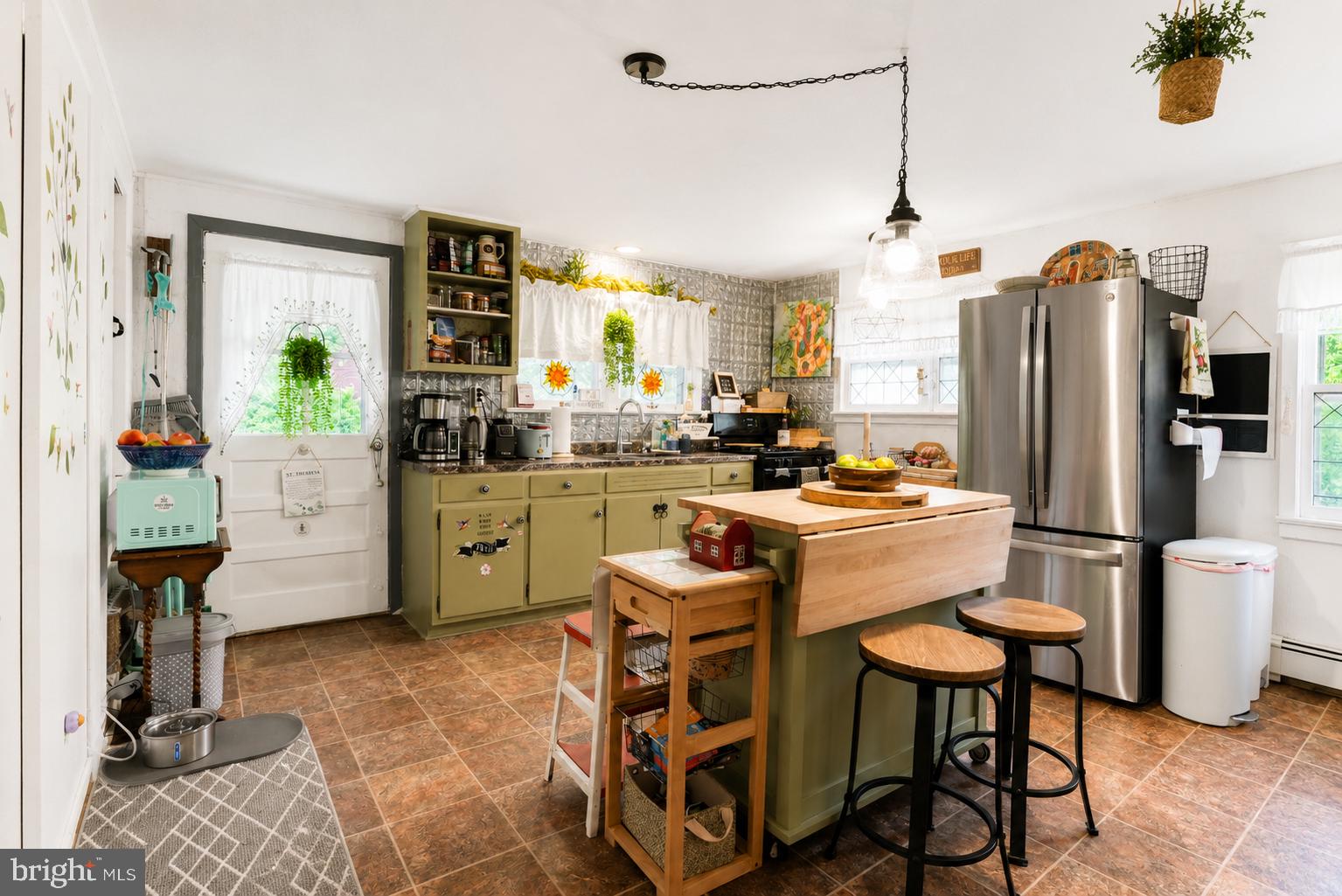 1470 River Road Titusville, NJ 08560 - Photo 25 of 50 a kitchen with a sink refrigerator and chairs