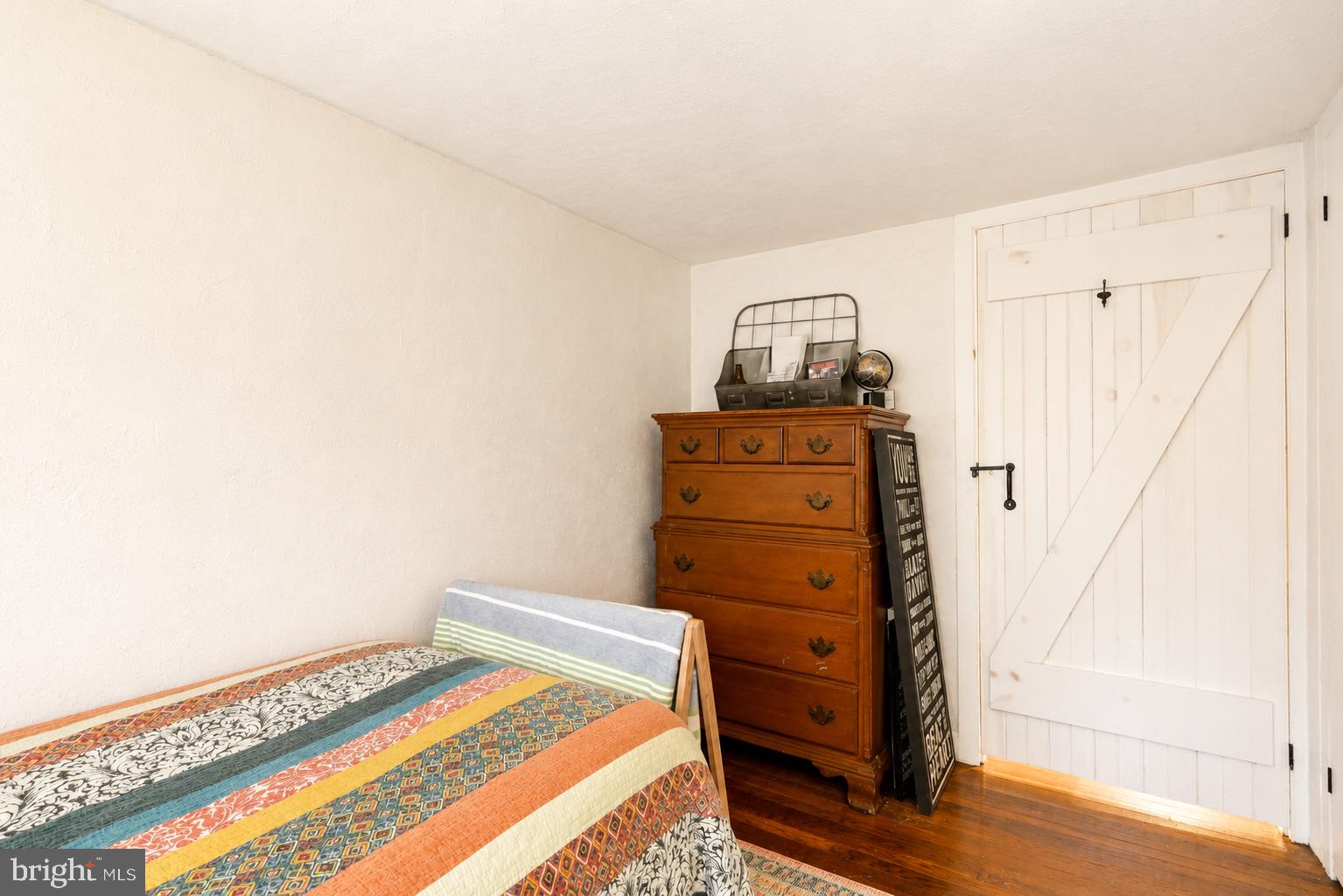 1470 River Road Titusville, NJ 08560 - Photo 31 of 50 a bedroom with a bed and wooden floor