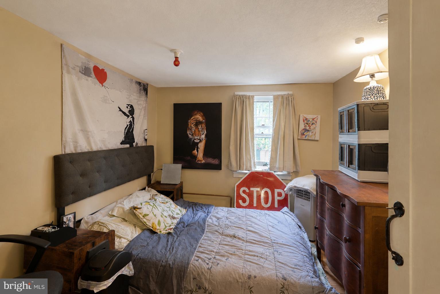 1470 River Road Titusville, NJ 08560 - Photo 34 of 50 a bedroom with a bed and a flat screen tv
