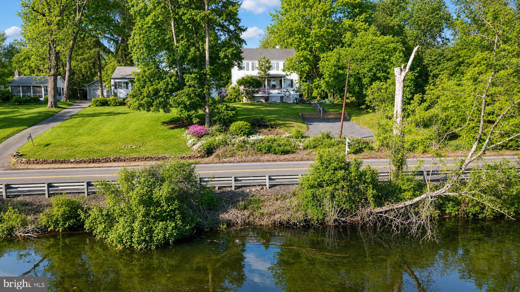 1470 River Road Titusville, NJ 08560 - Photo 4 of 50 a view of a garden with a lake view