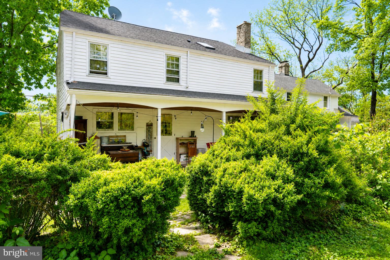 1470 River Road Titusville, NJ 08560 - Photo 10 of 50 a view of a house with a small yard plants and large tree