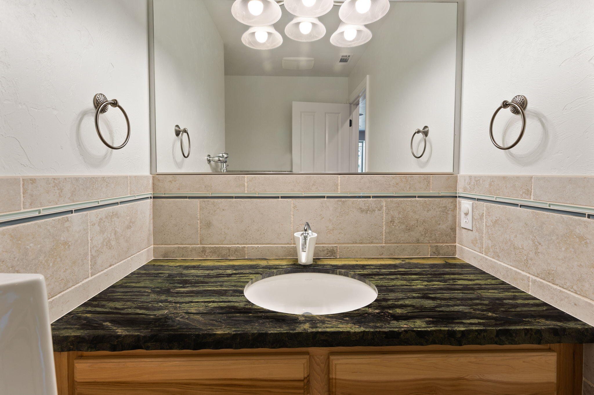 7304 North Applegate Road Grants Pass, OR 97527 - Photo 44 of 87 a bathroom with a sink and a mirror