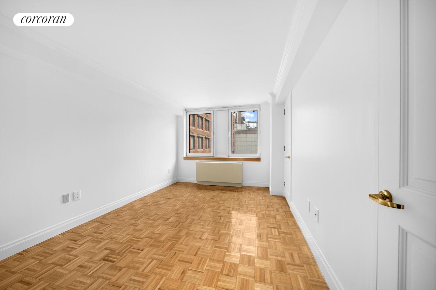 404 East 76th Street, Unit 3D Manhattan, NY 10021 - Photo 4 of 14 a view of an empty room