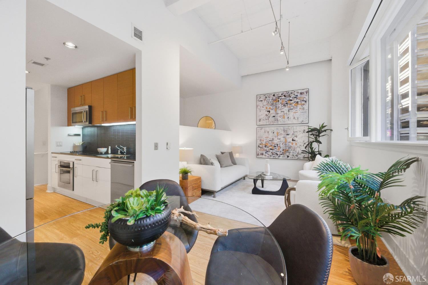 a bedroom with furniture and a large window
