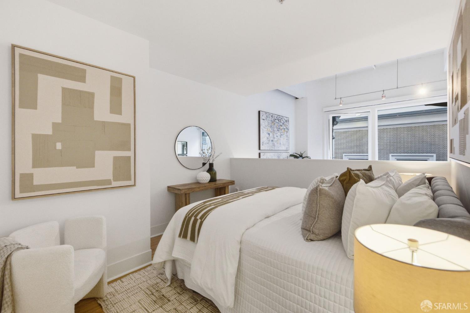 74 New Montgomery Street, Unit 211 San Francisco, CA 94105 - Photo 11 of 22 a bedroom with bed and a window