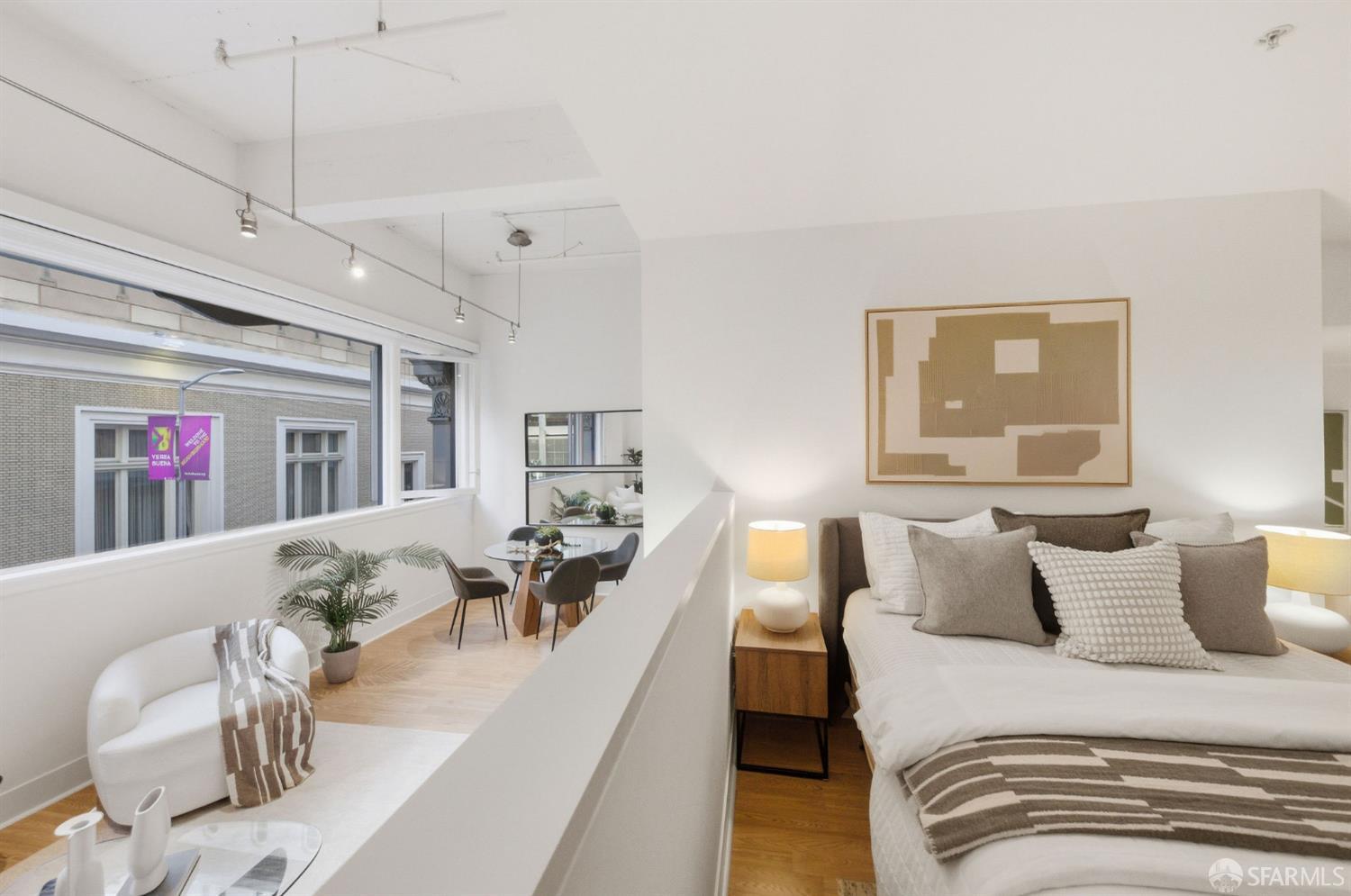 74 New Montgomery Street, Unit 211 San Francisco, CA 94105 - Photo 12 of 22 a bedroom with furniture and a large window