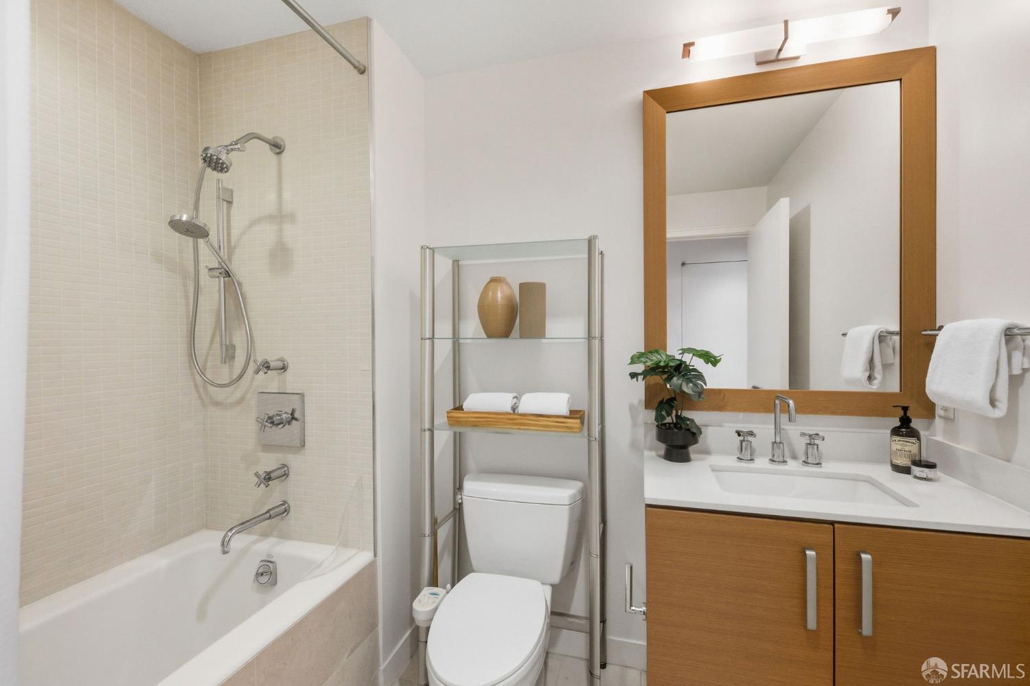 74 New Montgomery Street, Unit 211 San Francisco, CA 94105 - Photo 14 of 22 a bathroom with a granite countertop sink toilet and shower