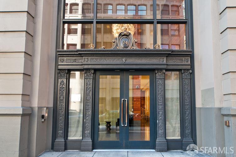 74 New Montgomery Street, Unit 211 San Francisco, CA 94105 - Photo 20 of 22 a living room that has a window and a glass door