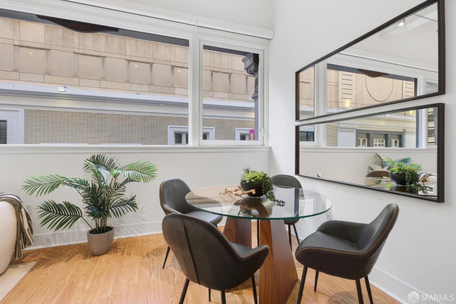 74 New Montgomery Street, Unit 211 San Francisco, CA 94105 - Photo 6 of 22 a dining room with furniture and wooden floor