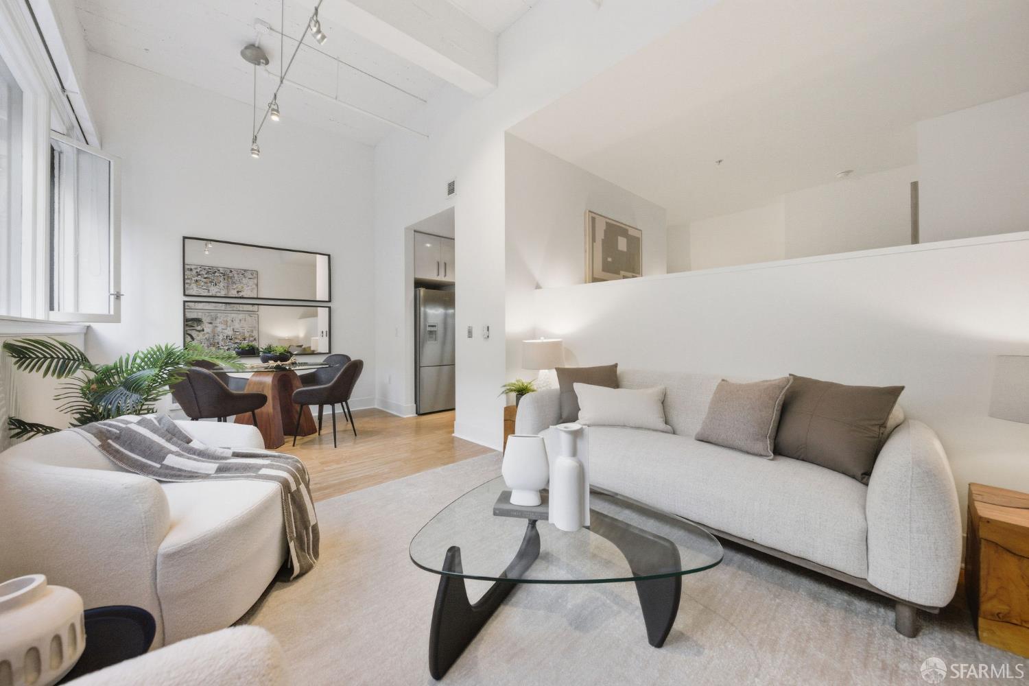 74 New Montgomery Street, Unit 211 San Francisco, CA 94105 - Photo 8 of 22 a living room with furniture and a large window