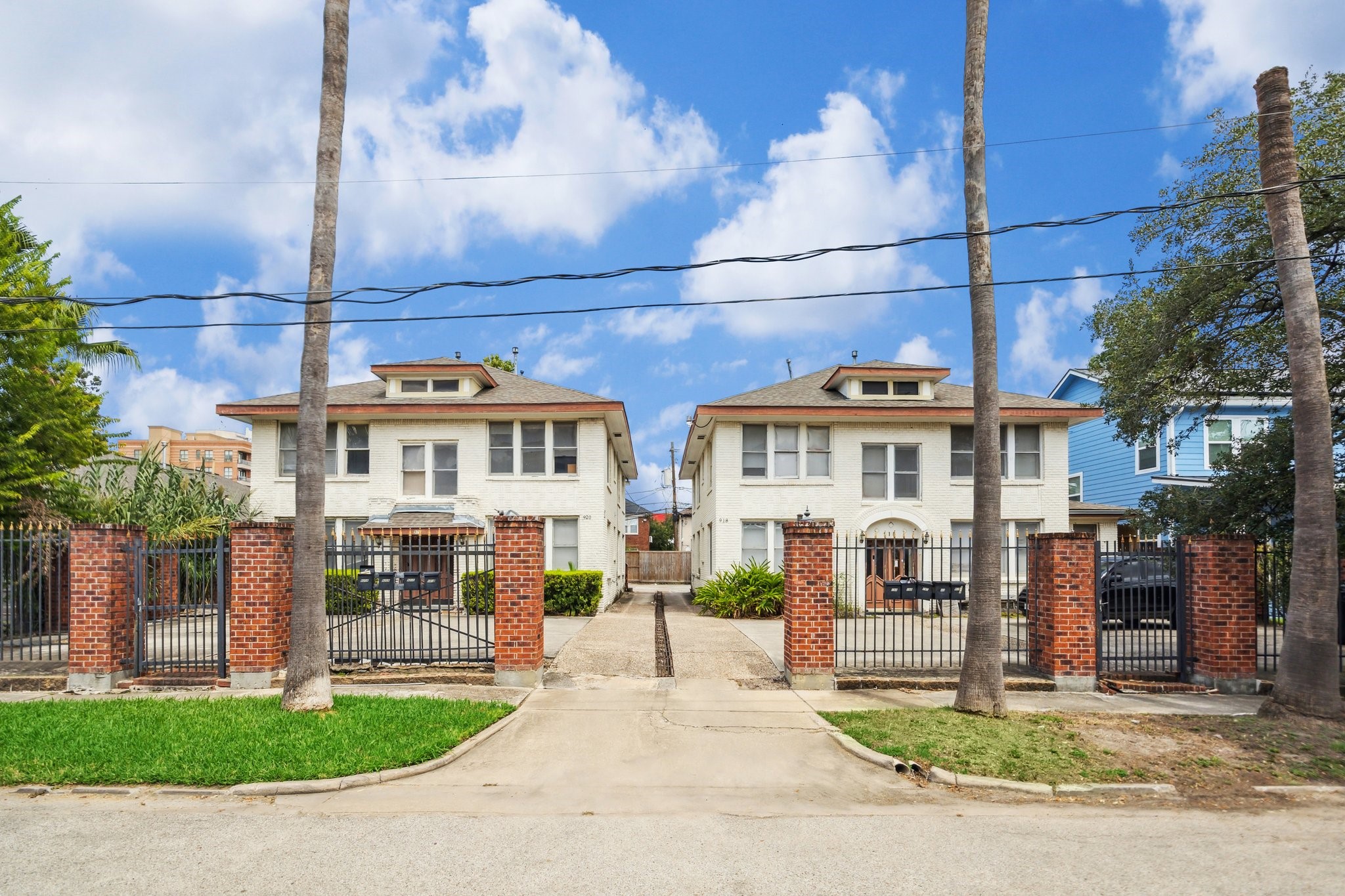 a front view of a houses with yard