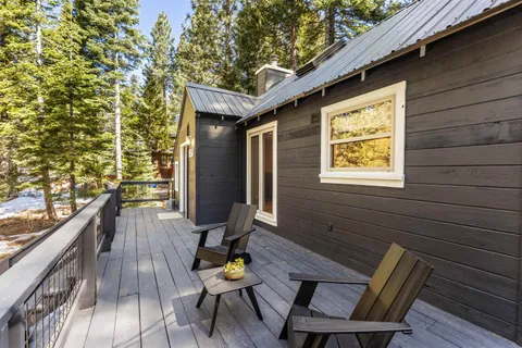a living room with a flat screen tv and a fireplace