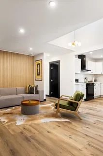a kitchen with granite countertop a sink stainless steel appliances and cabinets