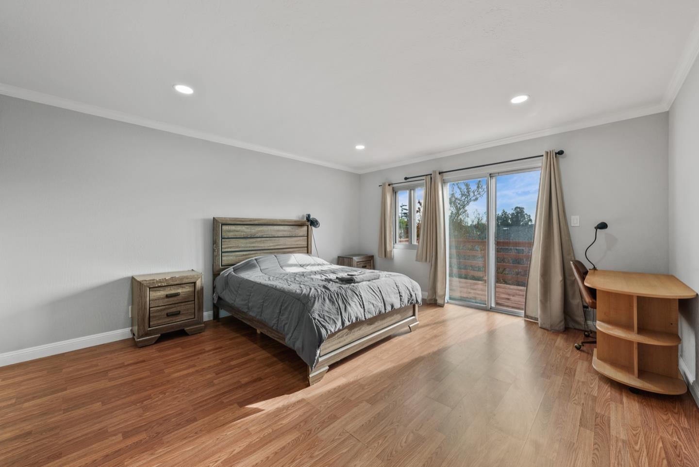 346 Cedar Street Millbrae, CA 94030 - Photo 14 of 43 a bedroom with a bed and wooden floor