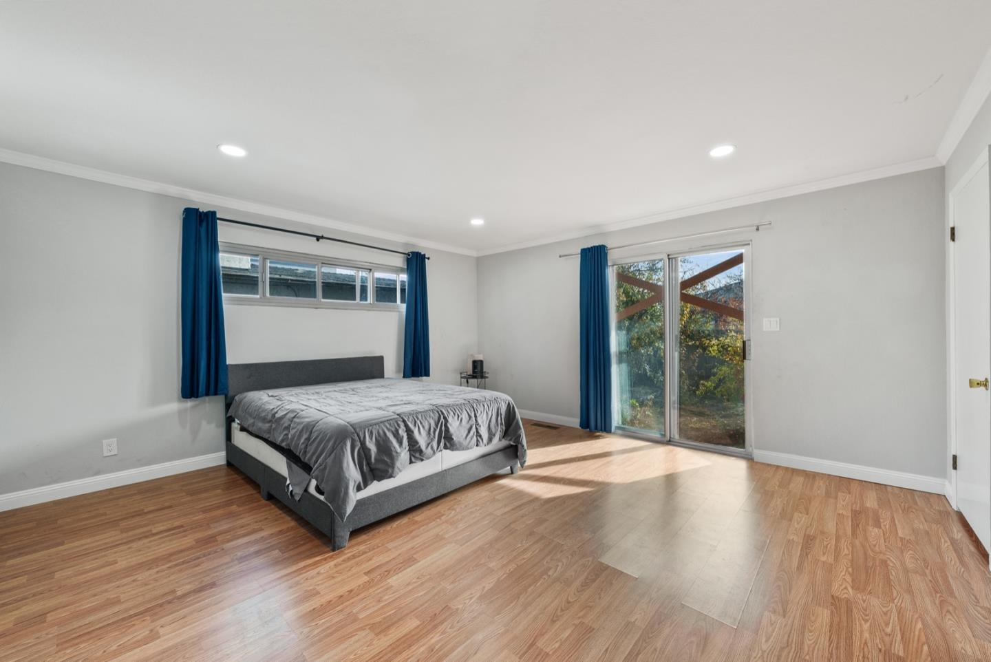 346 Cedar Street Millbrae, CA 94030 - Photo 18 of 43 a spacious bedroom with a large bed and a large window