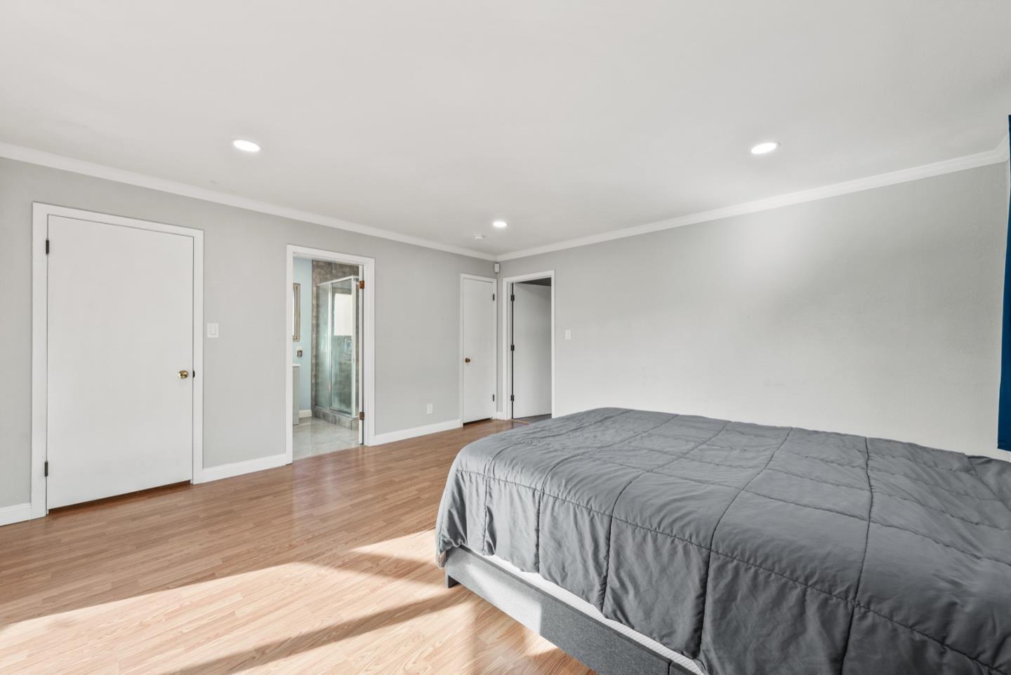 346 Cedar Street Millbrae, CA 94030 - Photo 22 of 43 a spacious bedroom with a bed and a dresser