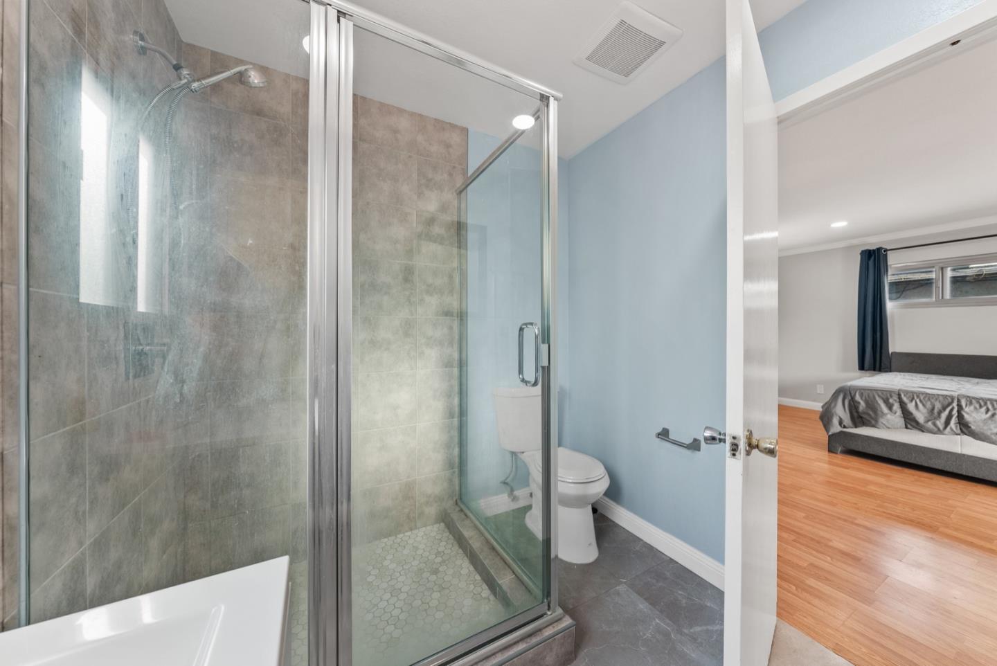 346 Cedar Street Millbrae, CA 94030 - Photo 28 of 43 a bathroom with a granite countertop shower mirror and toilet