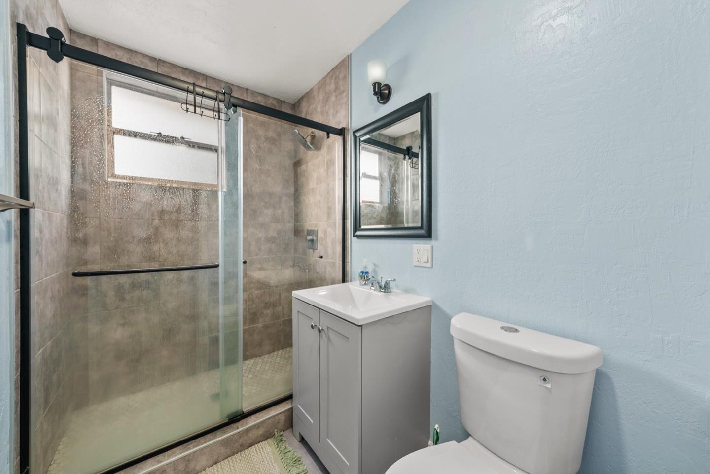 346 Cedar Street Millbrae, CA 94030 - Photo 29 of 43 a bathroom with a shower toilet and sink