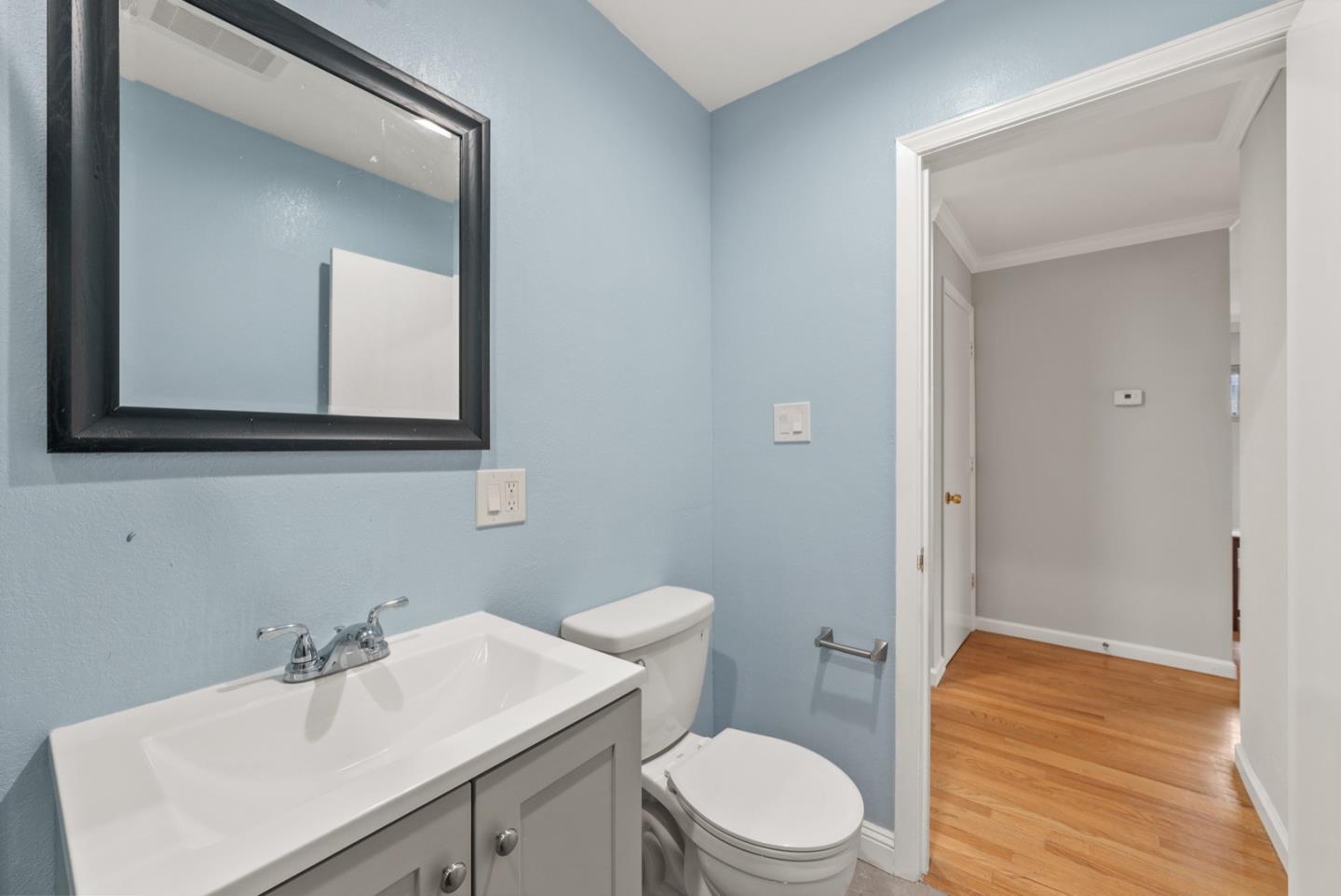 346 Cedar Street Millbrae, CA 94030 - Photo 32 of 43 a bathroom with a sink a toilet and mirror