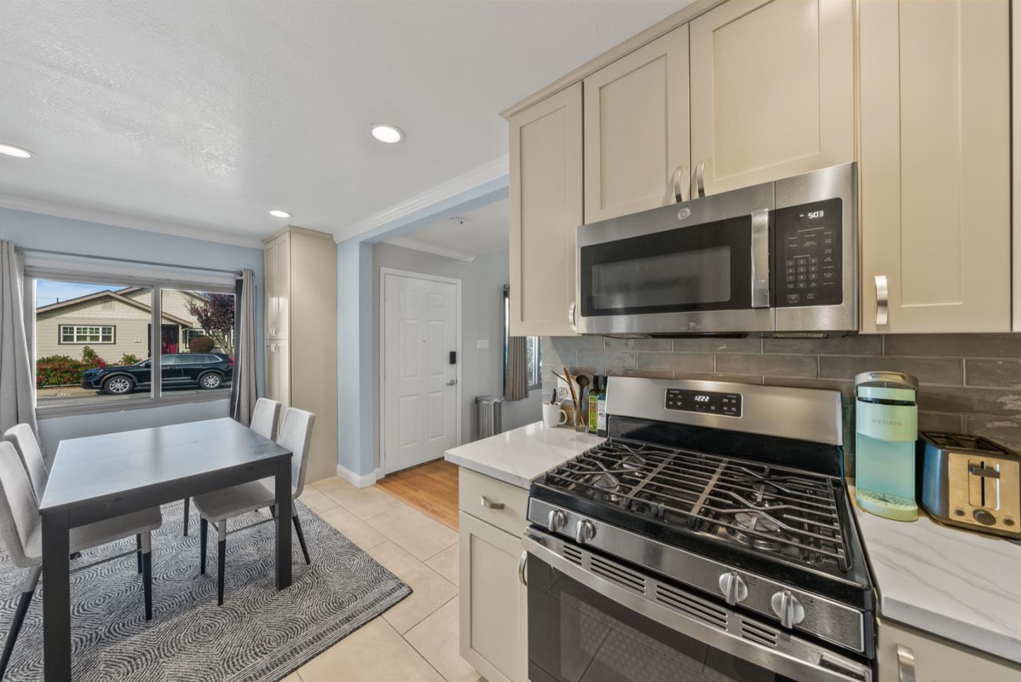 346 Cedar Street Millbrae, CA 94030 - Photo 6 of 43 a kitchen with a stove and a microwave
