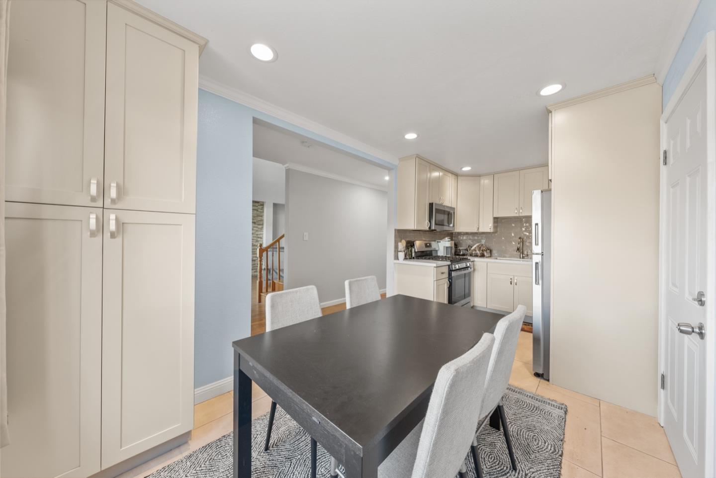 346 Cedar Street Millbrae, CA 94030 - Photo 9 of 43 a kitchen with a table and chairs