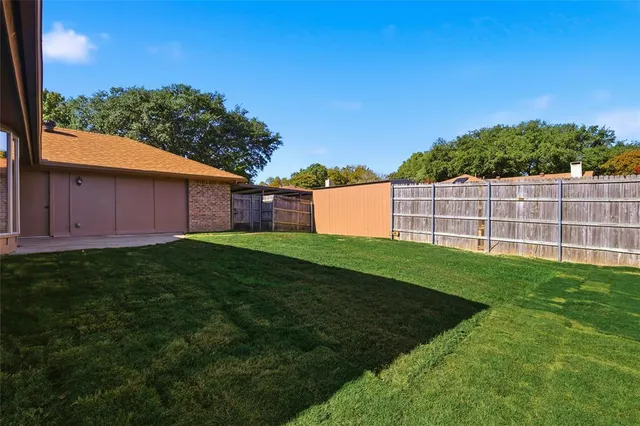 a view of a backyard with a garden