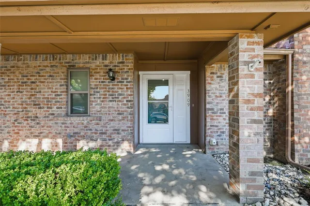 a front view of a house with a glass door