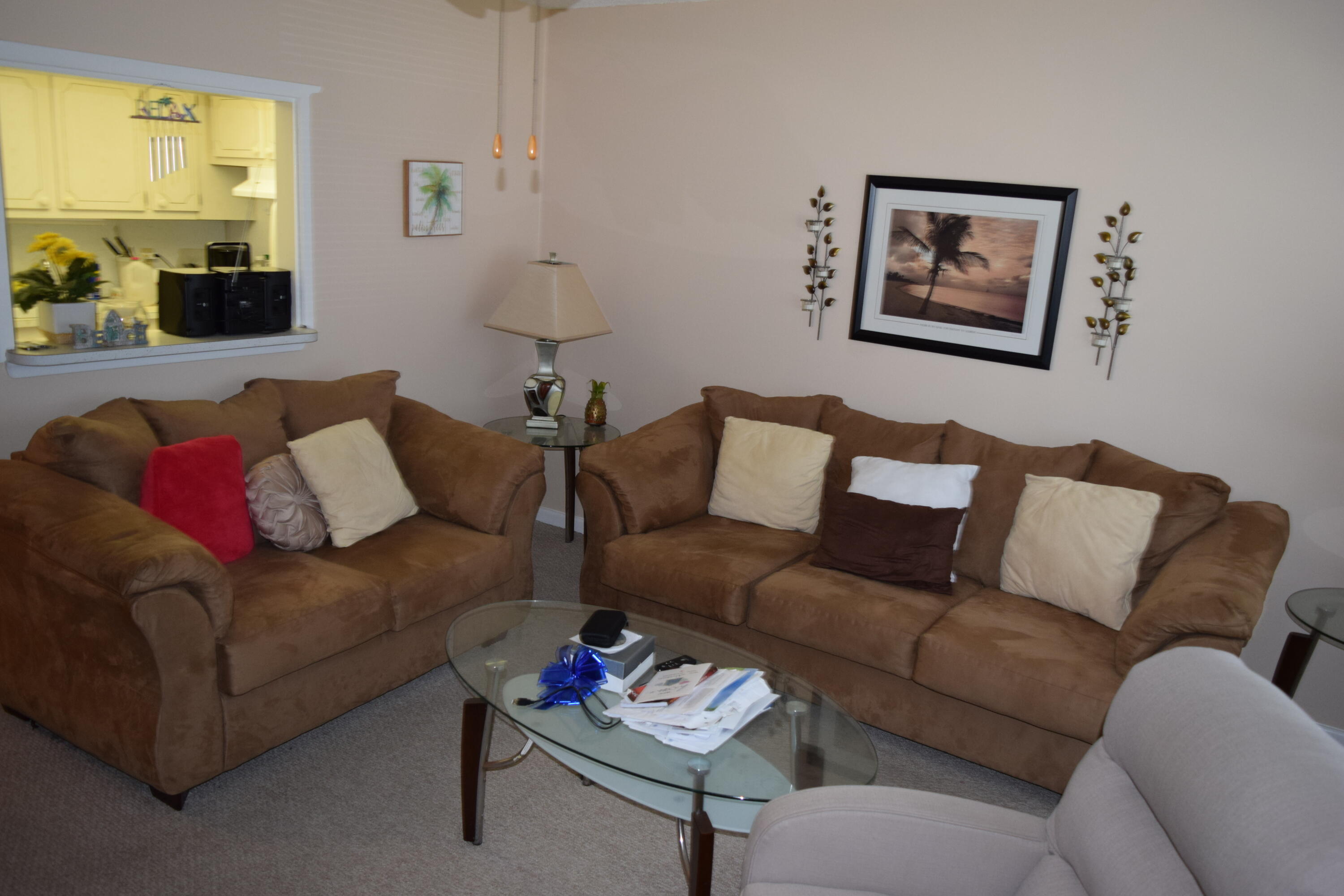 58 Sussex C, Unit C West Palm Beach, FL 33417 - Photo 2 of 22 a living room with furniture and a couch